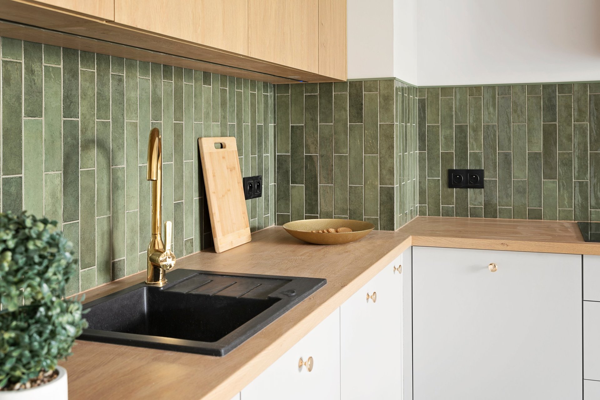 Modern kitchen with green ceramic tiles
